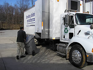 Our truck loads your bin directly